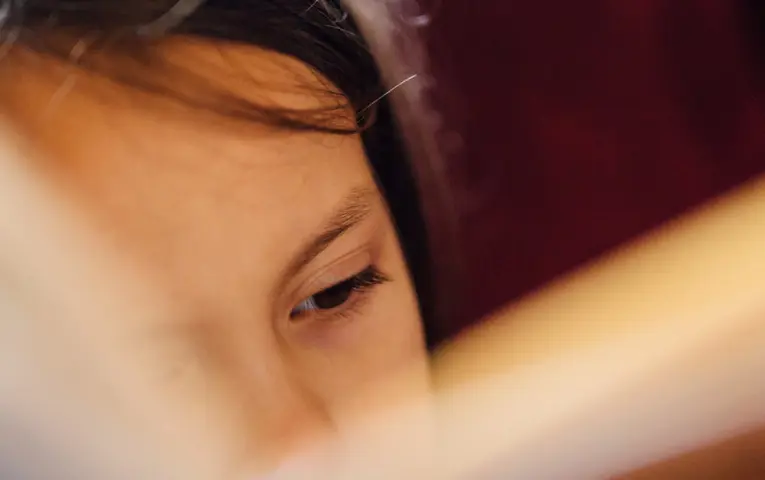 A young girl reading