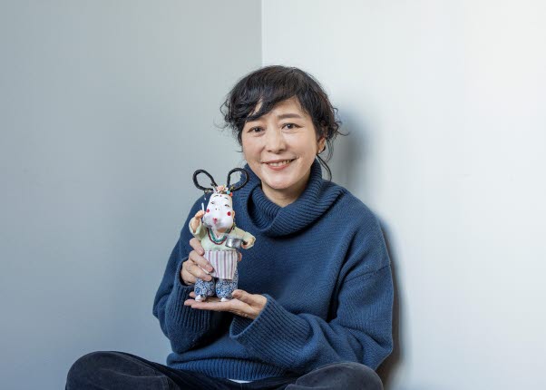 Baek Heena with her figurine Odd Mama