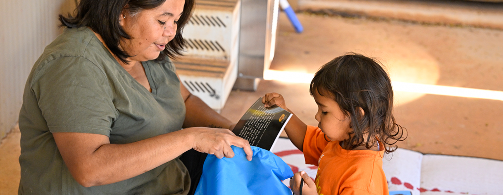 Woman reading for a young child