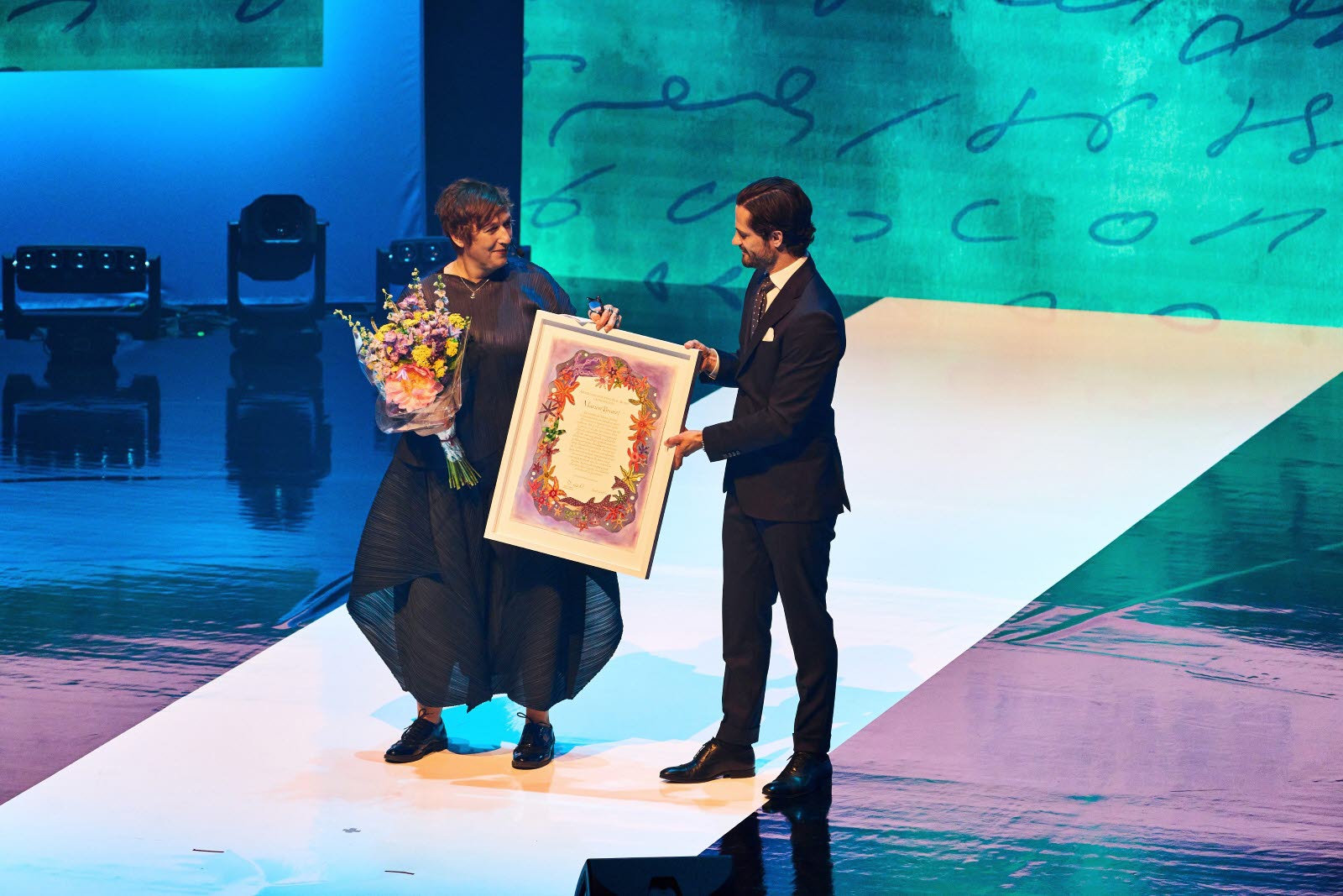 Marion Brunet accepting the award diploma from HRH Prince Carl Philip.