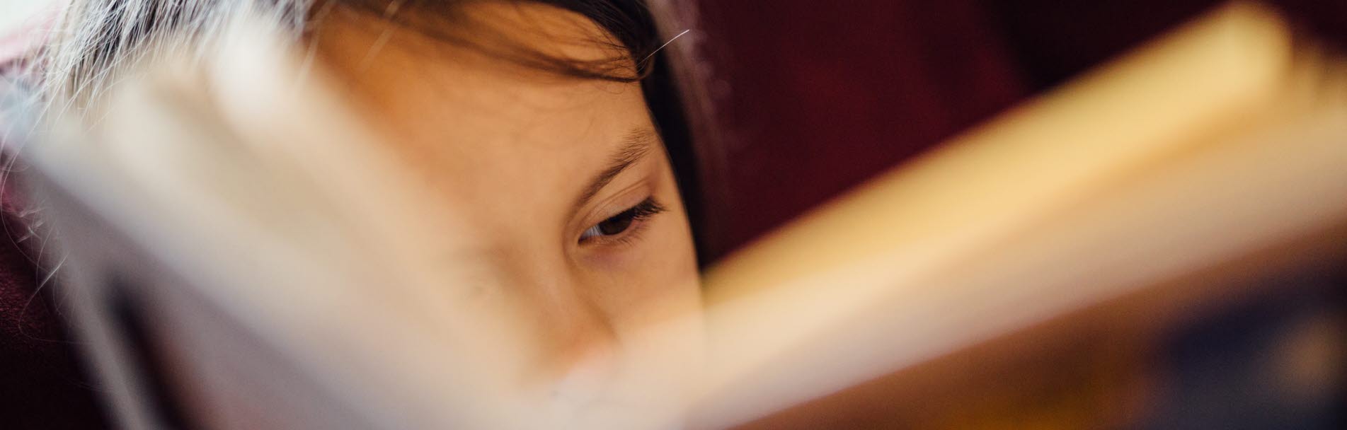 A child, reading a book